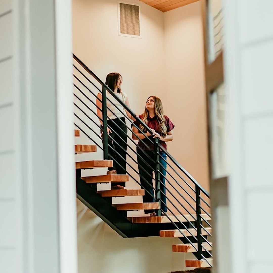 Bend, Oregon real estate brokers Erin Lovelace and Lacie Pech touring a modern home