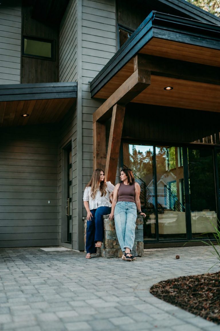 Erin Lovelace and Lacie Pech, Bend Oregon real estate brokers, outside a Central Oregon home